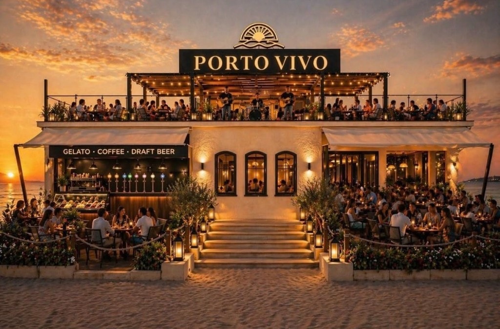 Porto Vivo beachfront restaurant glowing at golden hour over the Adriatic Sea